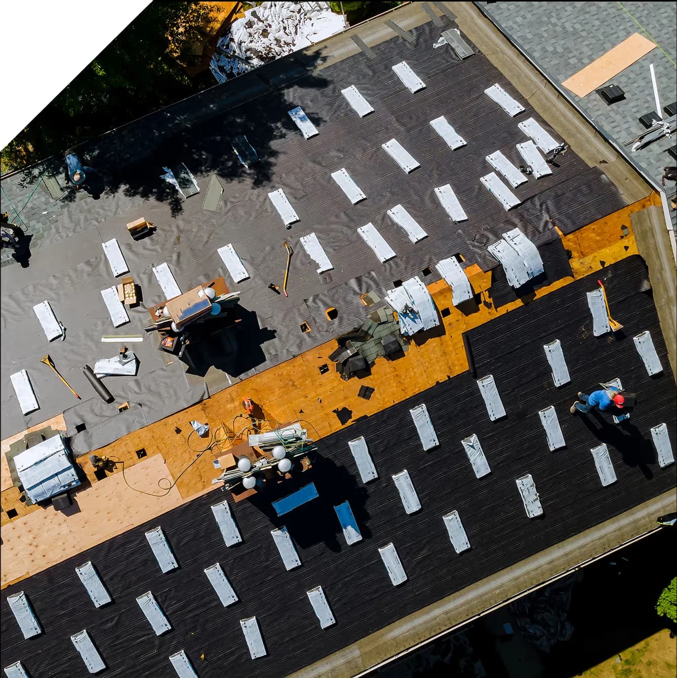 aerial view of a crew performing a roof replacement